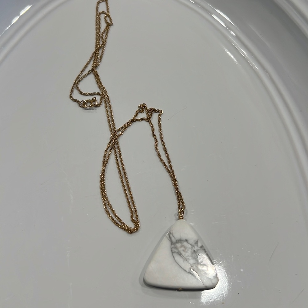 Long gold necklace with triangle marble pendant